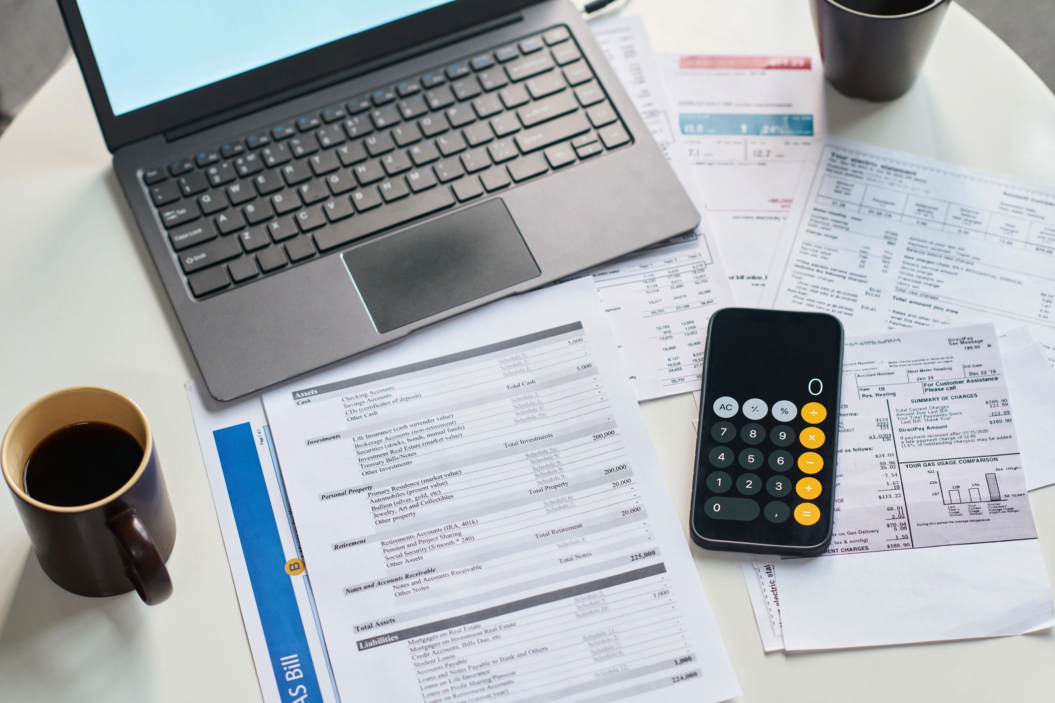 Financial documents and calculator on a workspace